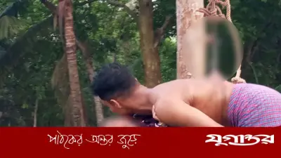 রাজবাড়ীতে চড়ক পূজায় পিঠে বড়শি বিঁধিয়ে শূন্যে ঘোরানো যুবক